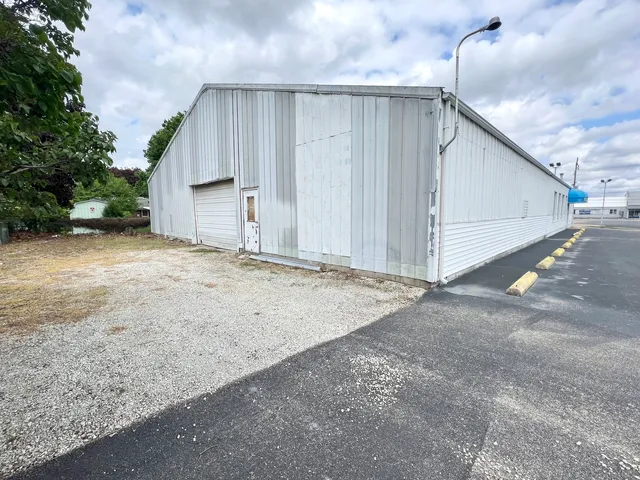 an aerial view of a house with a swimming pool