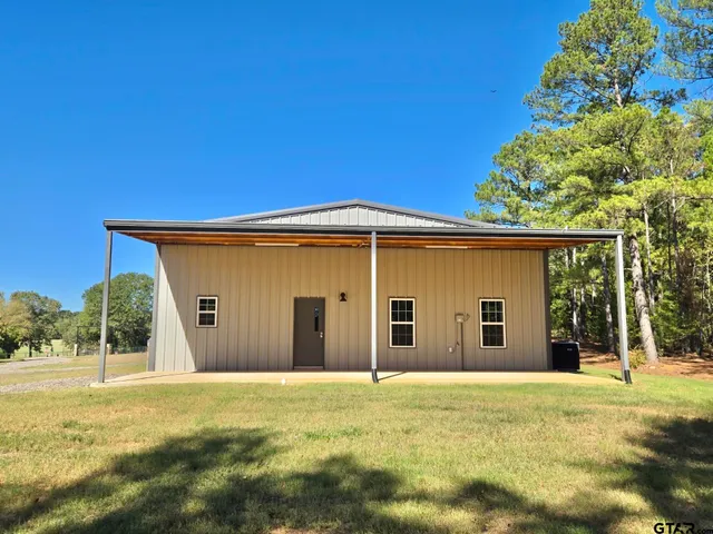 a view of an empty room with a fireplace