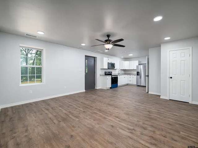 a bathroom with a shower and a sink