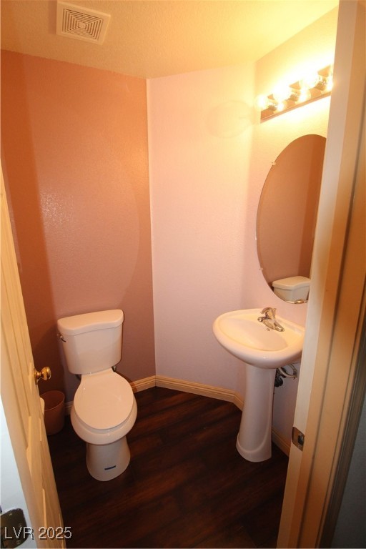 207 Priority Point Street Henderson, NV 89012 - Photo 11 of 38 Bathroom featuring dark wood-style flooring and a textured ceiling