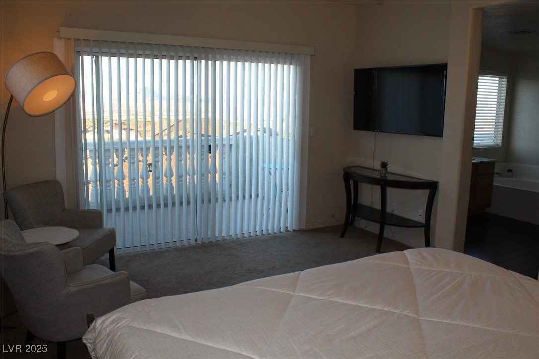 207 Priority Point Street Henderson, NV 89012 - Photo 17 of 38 Carpeted bedroom featuring access to exterior