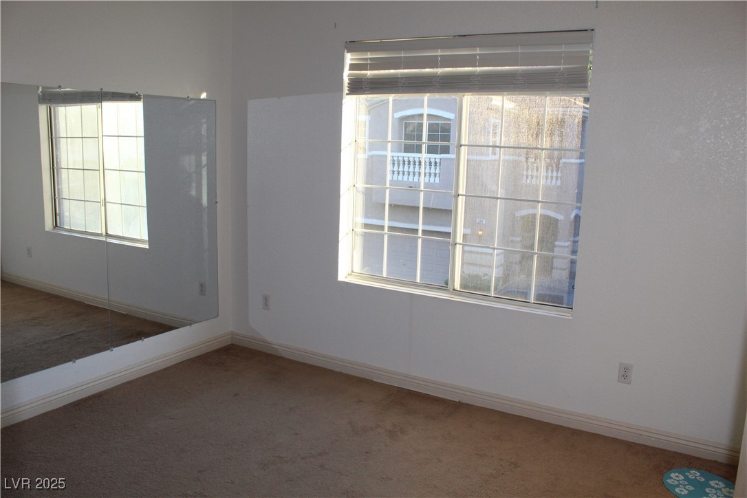 207 Priority Point Street Henderson, NV 89012 - Photo 25 of 38 Carpeted empty room featuring baseboards