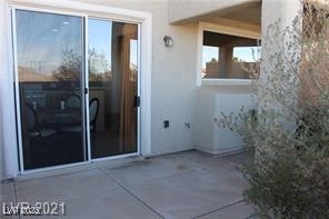 207 Priority Point Street Henderson, NV 89012 - Photo 30 of 38 View of exterior entry featuring a patio and stucco siding