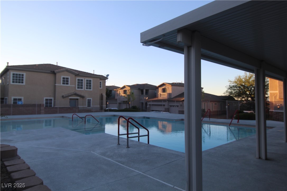 207 Priority Point Street Henderson, NV 89012 - Photo 34 of 38 Community pool with a patio area and a residential view
