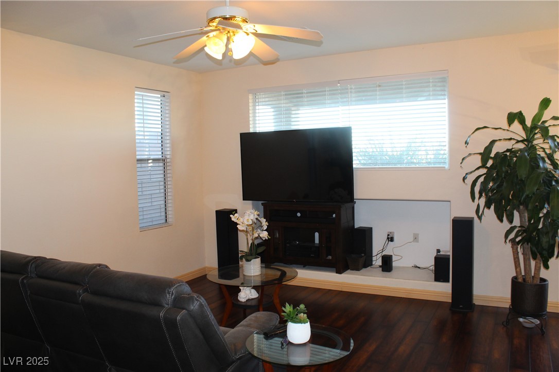 207 Priority Point Street Henderson, NV 89012 - Photo 9 of 38 Living room with wood finished floors and a ceiling fan