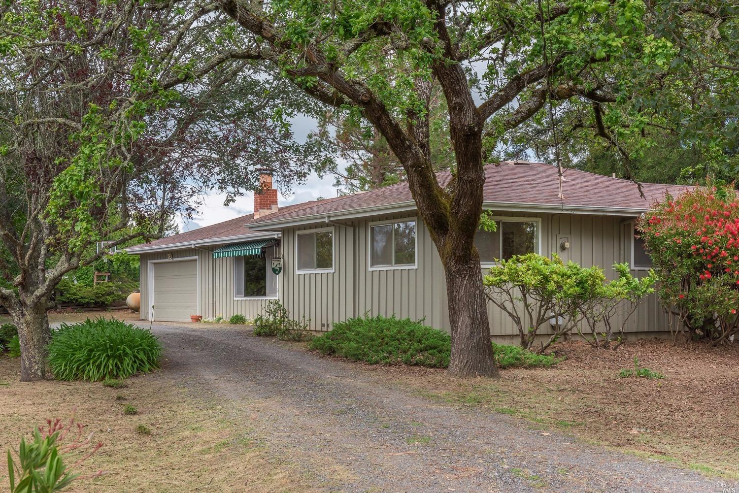 10942 Cherry Ridge Road Sebastopol, CA 95472 - Photo 1 of 1 a front view of a house with garden