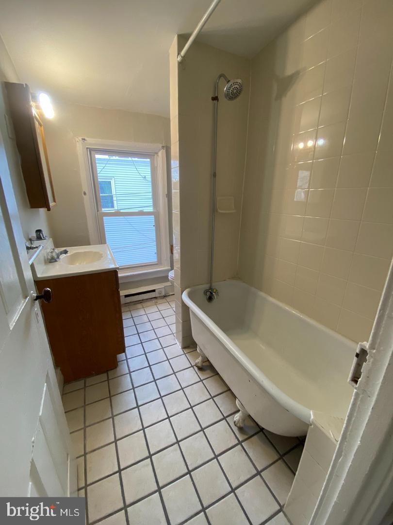 64 South Evans Street, Unit 3 Pottstown, PA 19464 - Photo 9 of 15 a bathroom with a bathtub and a shower
