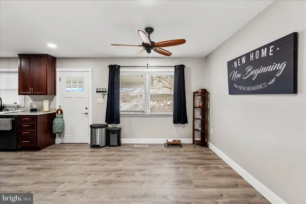 a view of a kitchen with a sink and a window