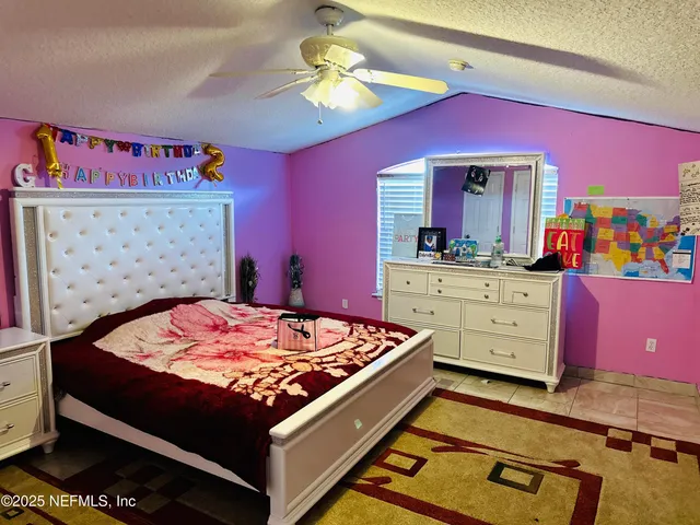 a bed room with a bed and a dresser