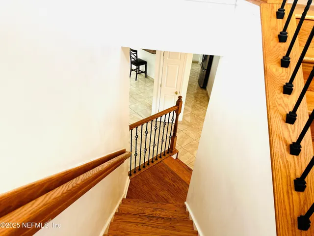 a view of balcony with wooden floor