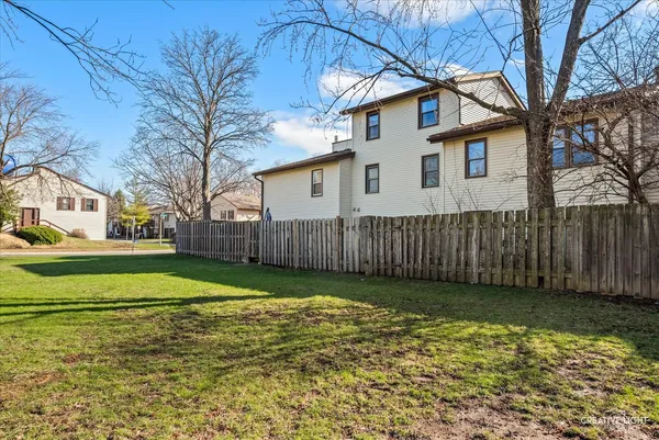 a view of a yard in front view of a house