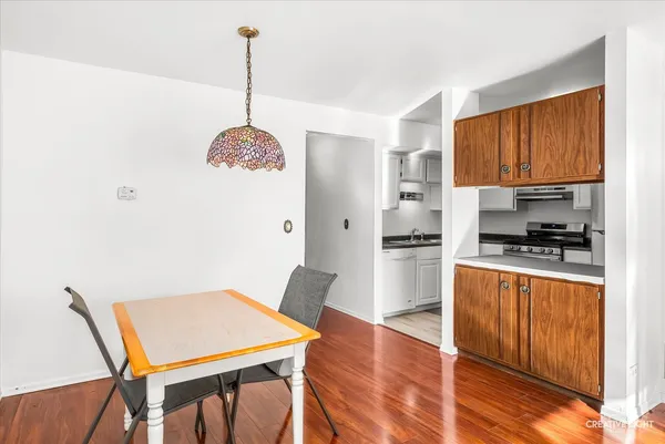 a kitchen with stainless steel appliances granite countertop a stove refrigerator sink and cabinets