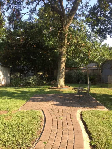 a view of yard with swimming pool and outdoor seating