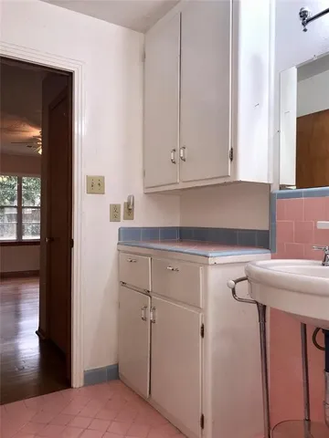 a kitchen with a sink and cabinets