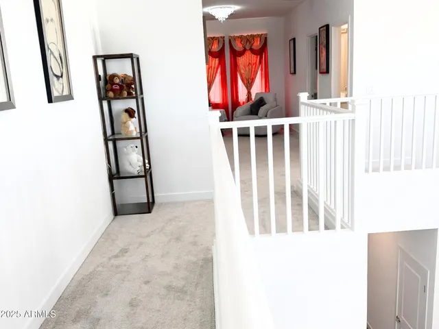 a view of a livingroom with wooden floor and windows