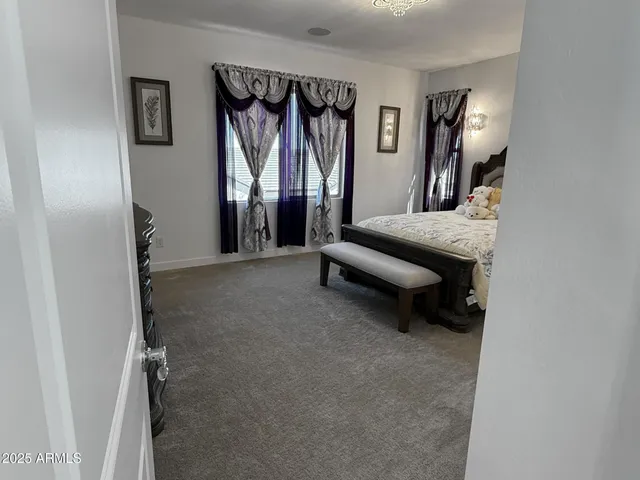 a view of a livingroom with furniture and windows