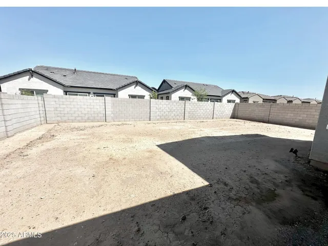 a view of a backyard of the house