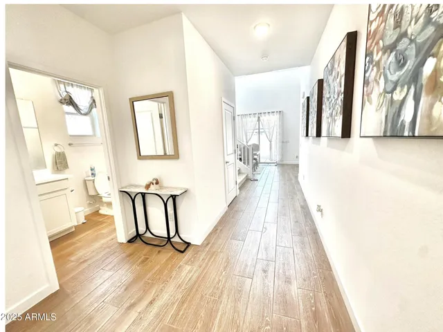 a view of a living room with a wooden floor