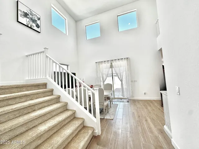 a view of staircase with white walls