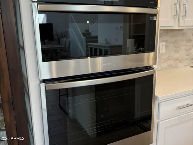 a kitchen with a stove and a microwave