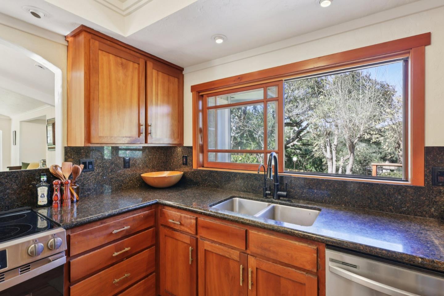 122 Strawberry Road Watsonville, CA 95076 - Photo 14 of 57 a kitchen with stainless steel appliances granite countertop sink stove and cabinets