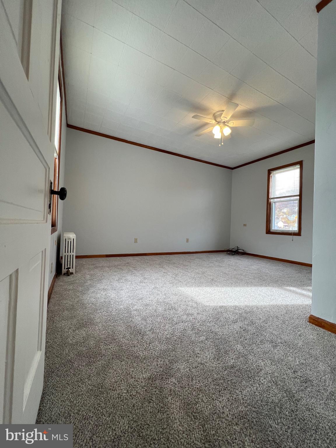 906 Lemon Street Johnstown, PA 15902 - Photo 3 of 13 an empty room with a empty space and windows