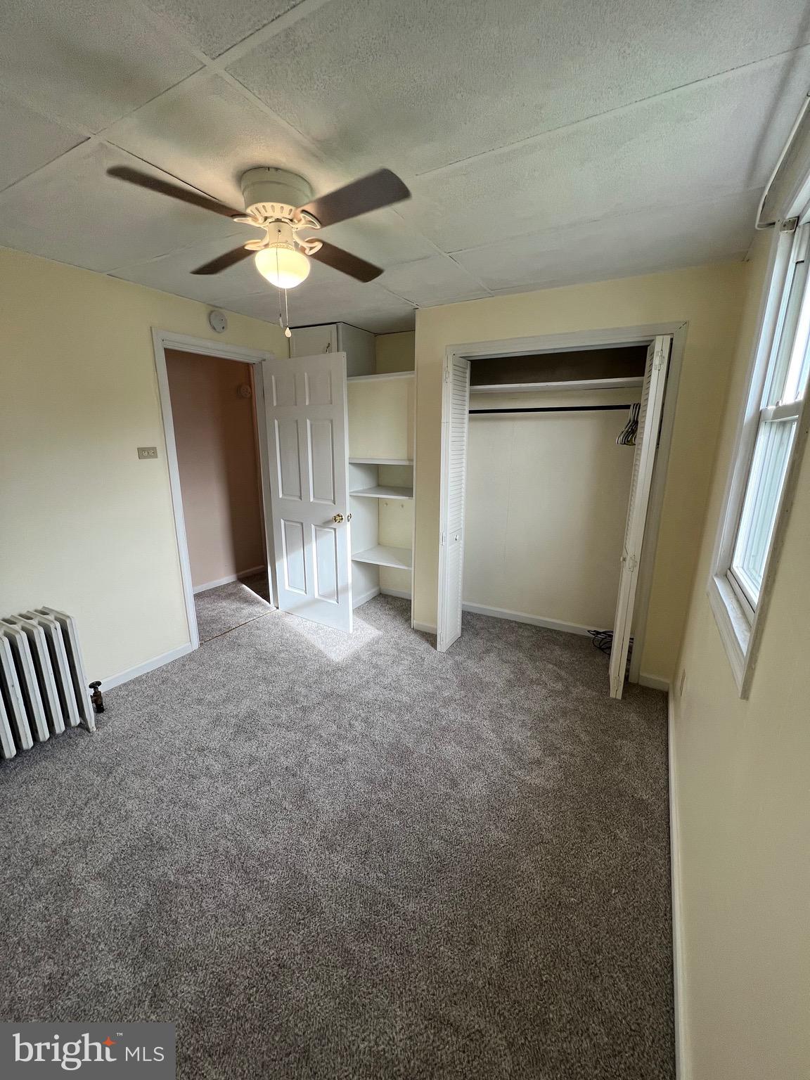 906 Lemon Street Johnstown, PA 15902 - Photo 4 of 13 a view of a livingroom with a ceiling fan and window