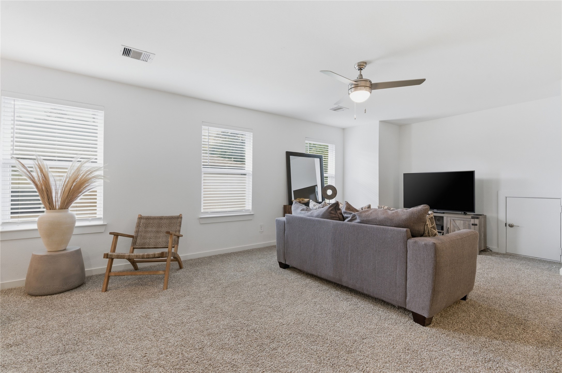 14108 Redfish Lake Conroe, TX 77384 - Photo 21 of 37 a living room with furniture and a flat screen tv