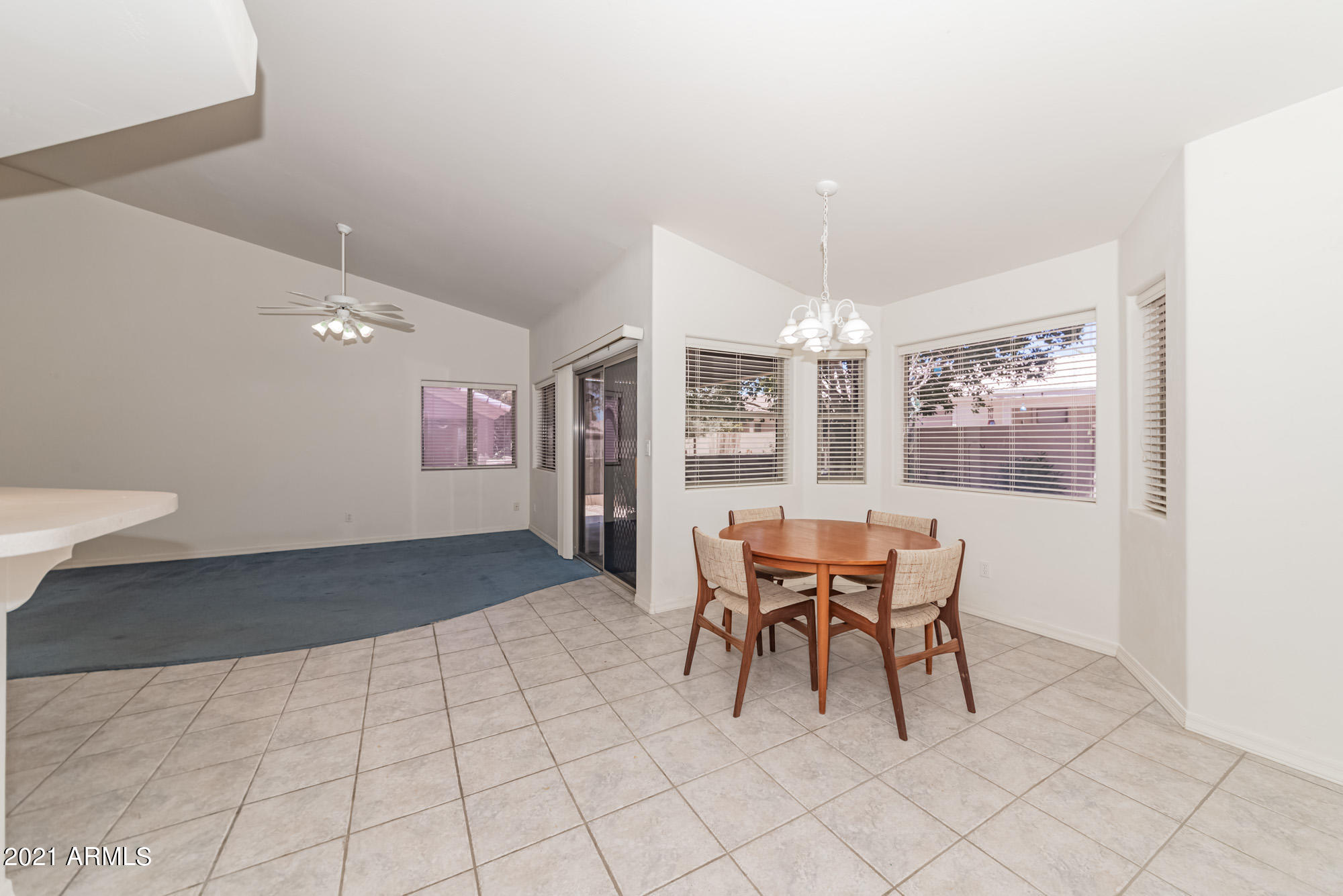 5830 East McKellips Road, Unit 56 Mesa, AZ 85215 - Photo 16 of 47 a dining room with furniture and window
