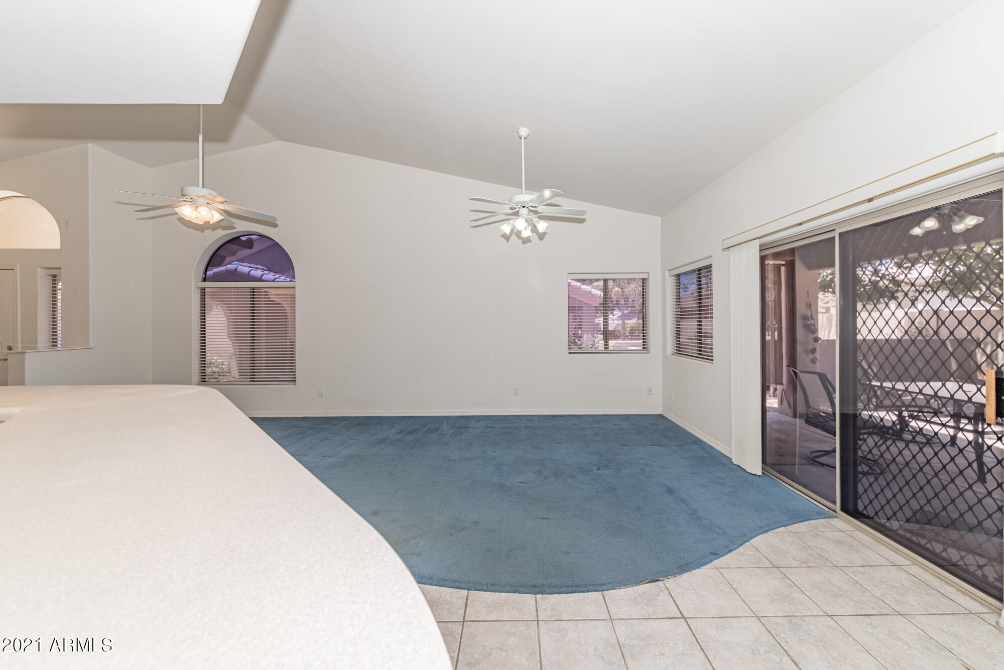 5830 East McKellips Road, Unit 56 Mesa, AZ 85215 - Photo 17 of 47 a view of a bedroom with window and ceiling fan
