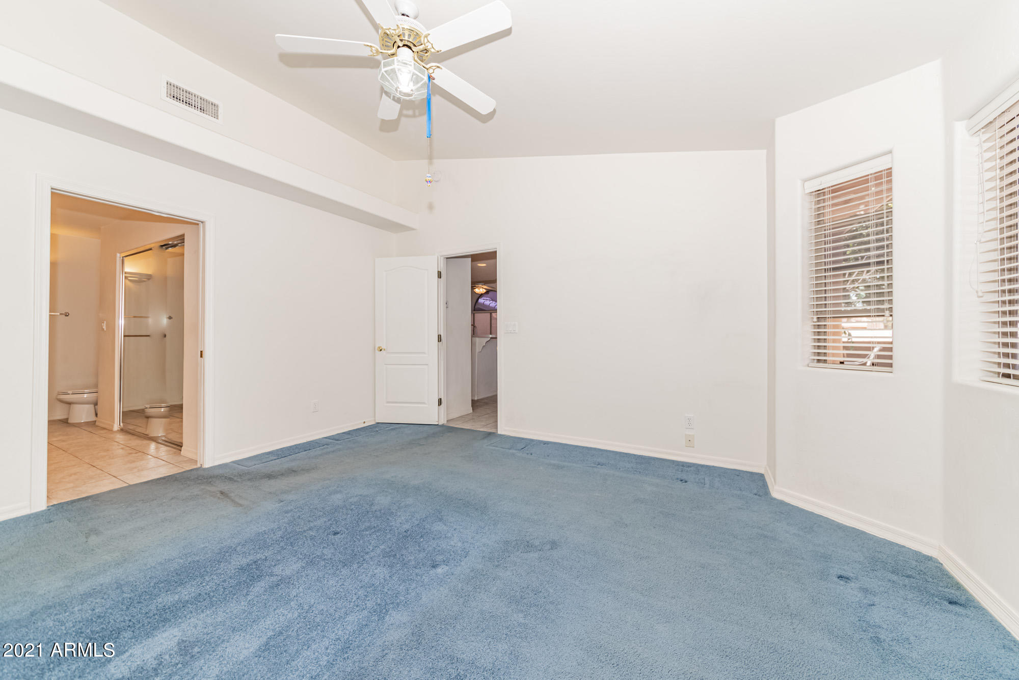 5830 East McKellips Road, Unit 56 Mesa, AZ 85215 - Photo 19 of 47 a view of an empty room with a window