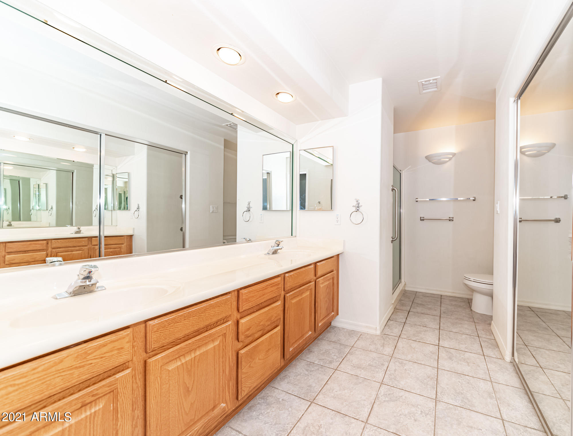 5830 East McKellips Road, Unit 56 Mesa, AZ 85215 - Photo 22 of 47 a spacious bathroom with a granite countertop sink mirror and shower