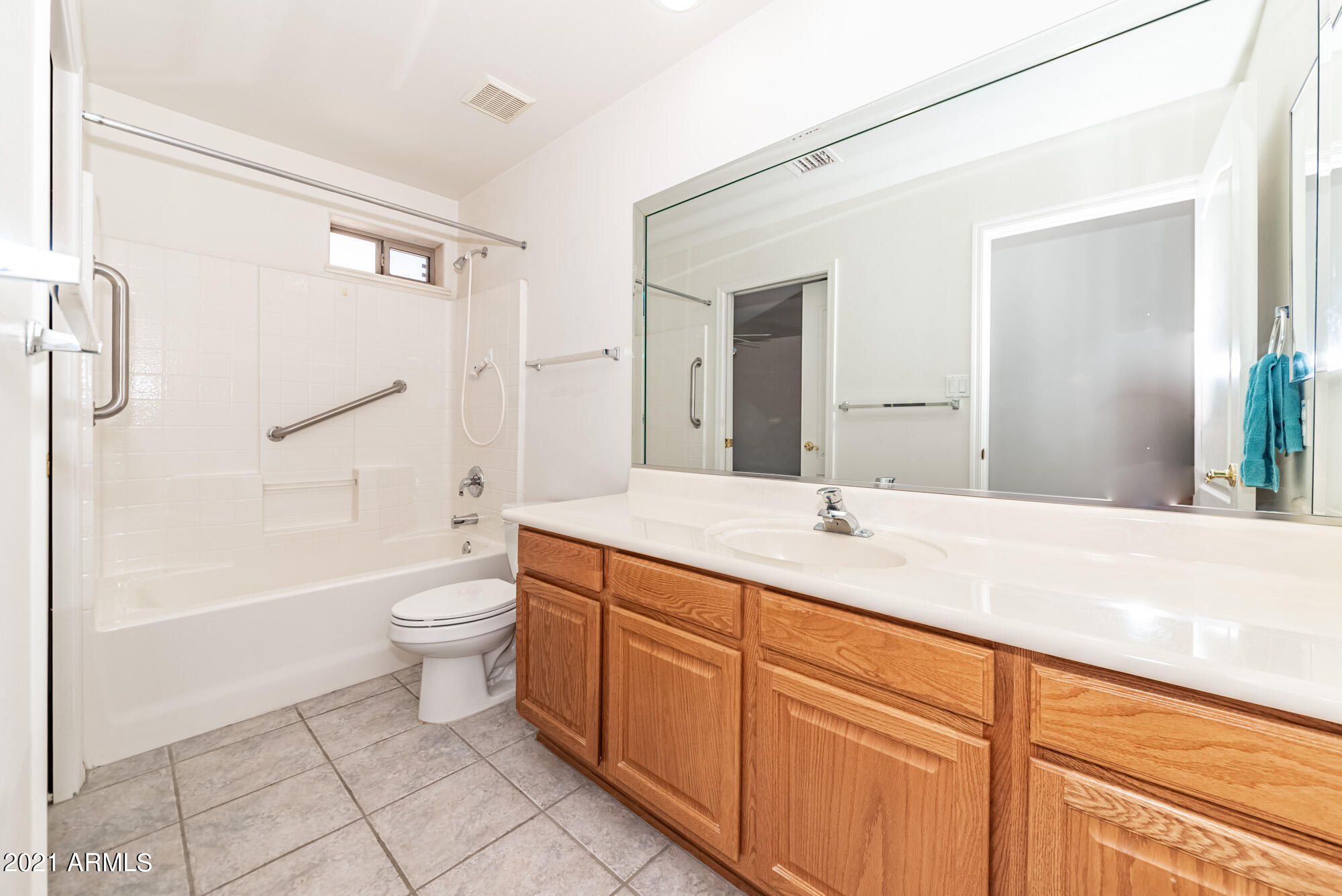 5830 East McKellips Road, Unit 56 Mesa, AZ 85215 - Photo 27 of 47 a bathroom with a granite countertop sink toilet and shower