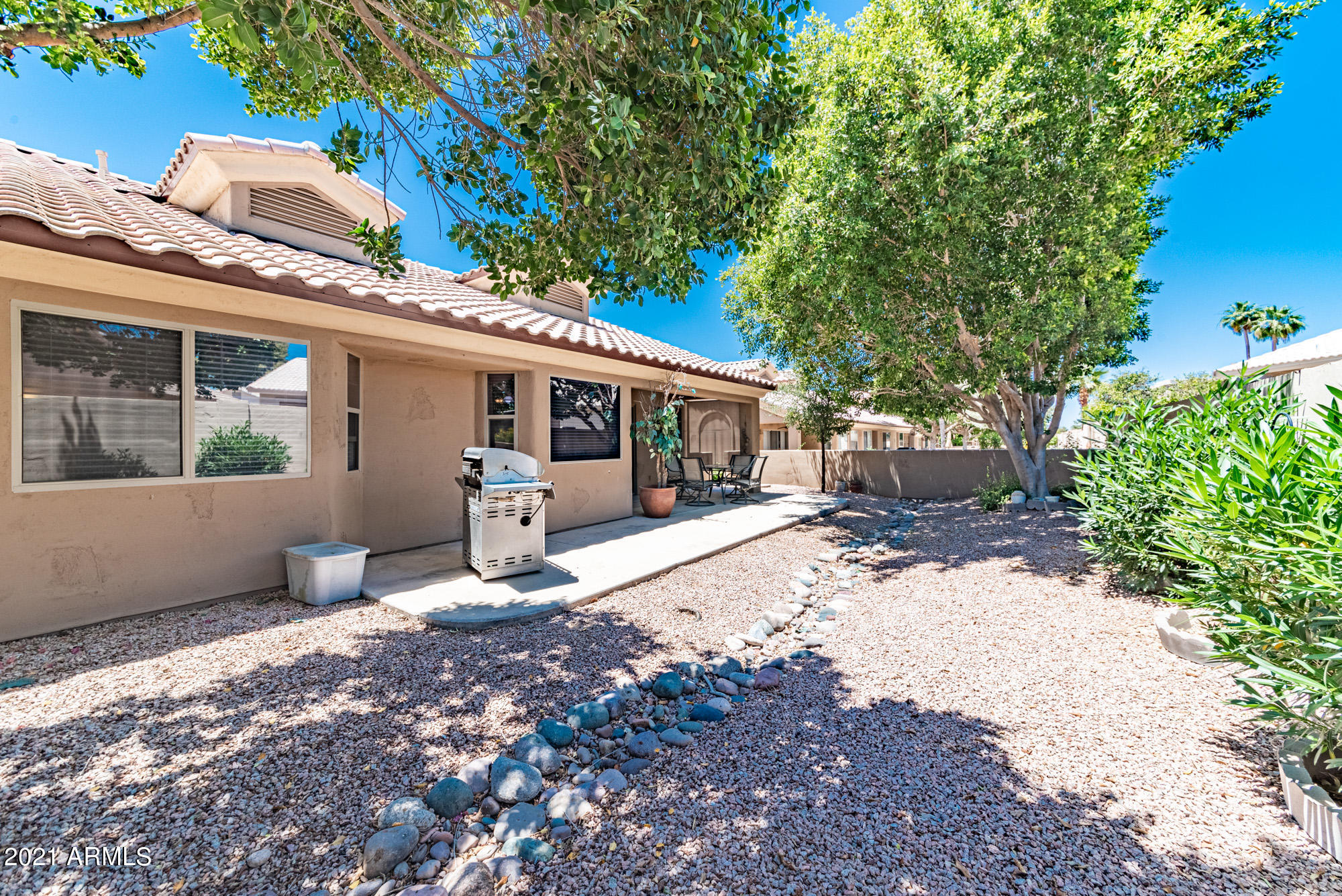 5830 East McKellips Road, Unit 56 Mesa, AZ 85215 - Photo 30 of 47 a view of a house with backyard and sitting area