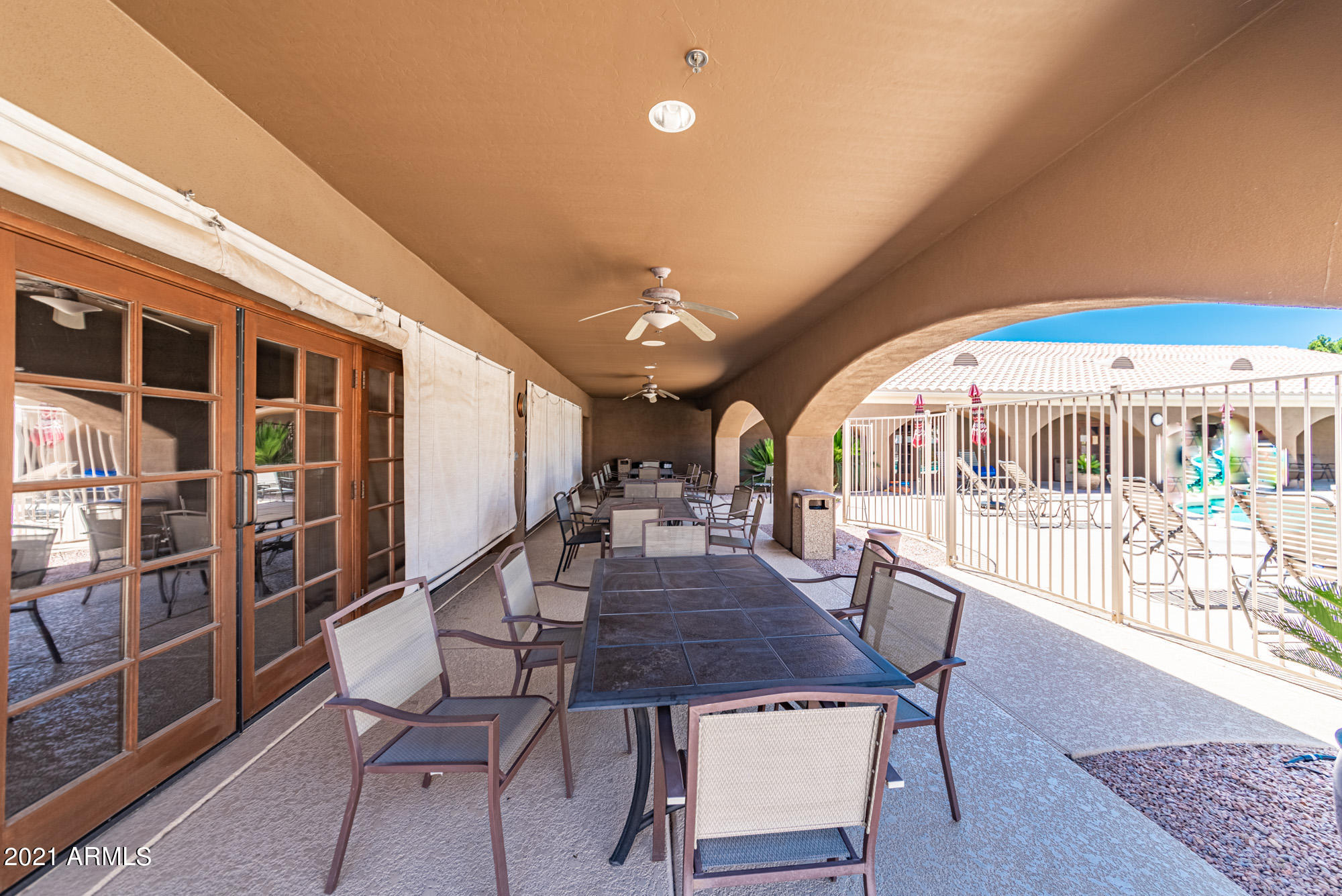 5830 East McKellips Road, Unit 56 Mesa, AZ 85215 - Photo 40 of 47 a view of a dining room with furniture window and wooden floor