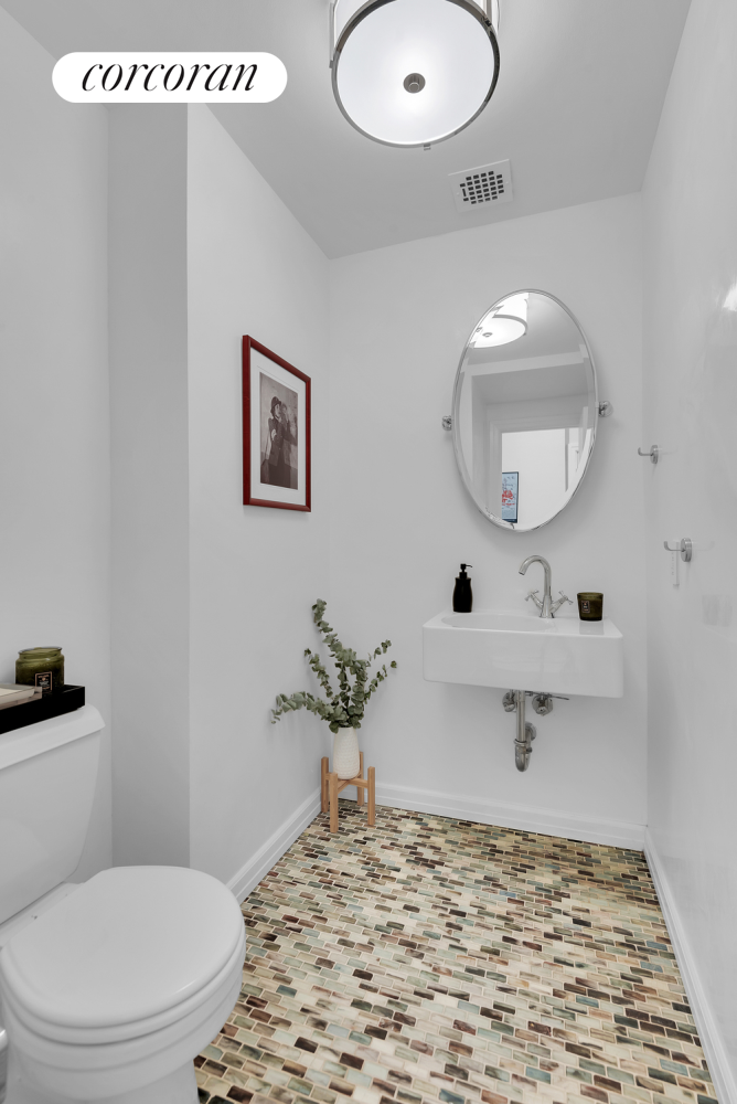 30 West 86th Street, Unit 2B Manhattan, NY 10024 - Photo 10 of 12 a bathroom with a sink a toilet and a mirror