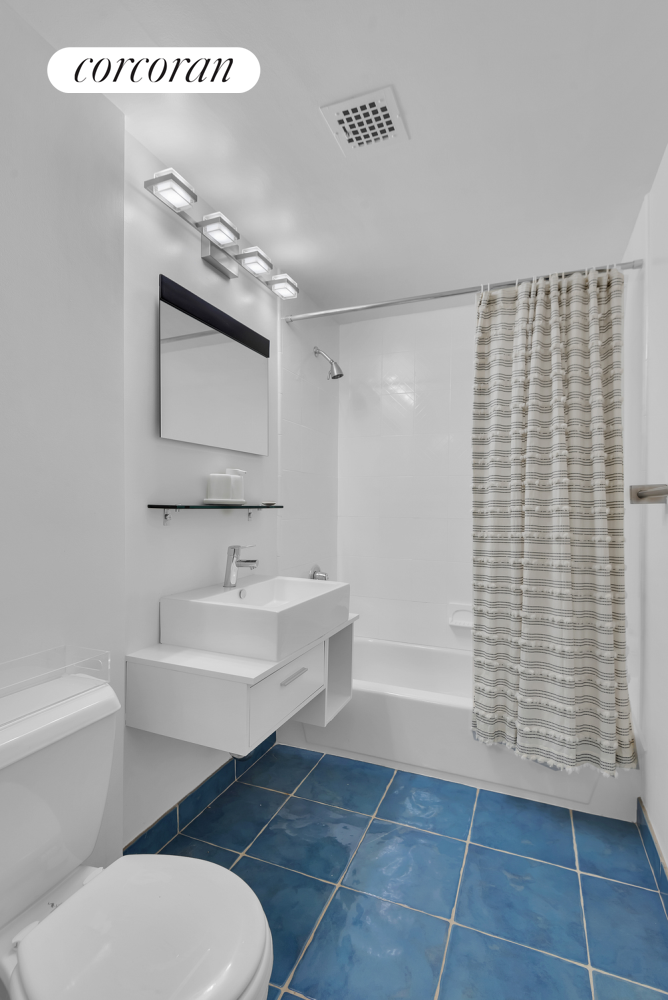 30 West 86th Street, Unit 2B Manhattan, NY 10024 - Photo 9 of 12 a bathroom with a sink a toilet and shower