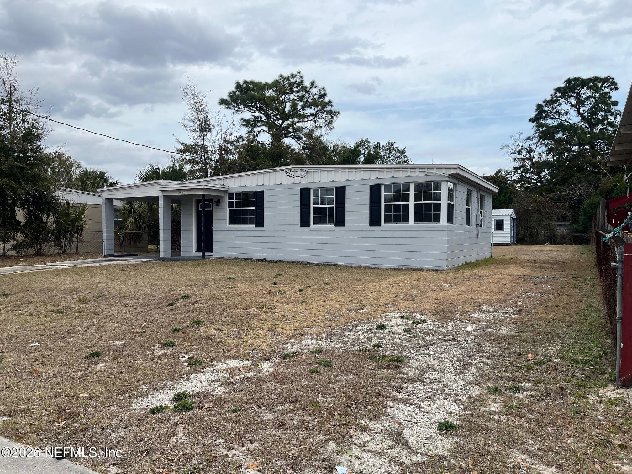 10547 Briarcliff Road East Jacksonville, FL 32218 - Photo 3 of 33 a front view of a house with a garden