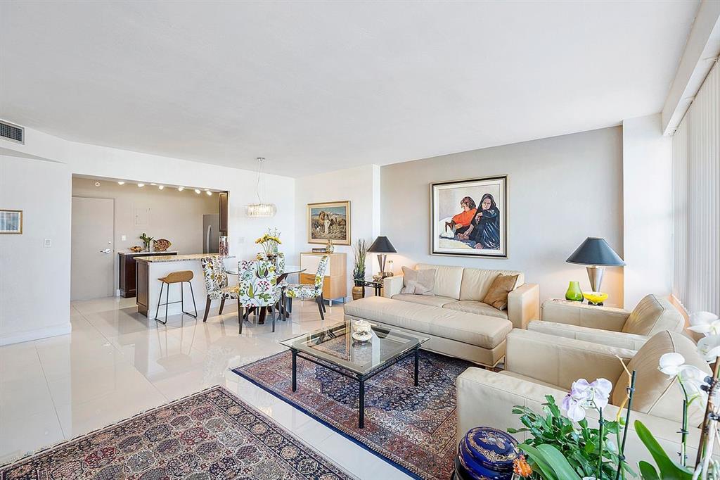3300 Northeast 36th Street, Unit 303 Fort Lauderdale, FL 33308 - Photo 11 of 53 a living room with furniture potted plant and a table
