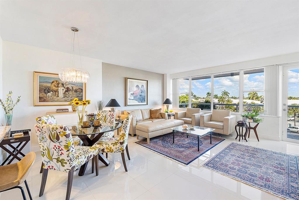 3300 Northeast 36th Street, Unit 303 Fort Lauderdale, FL 33308 - Photo 14 of 53 a living room with furniture dining table and a large window