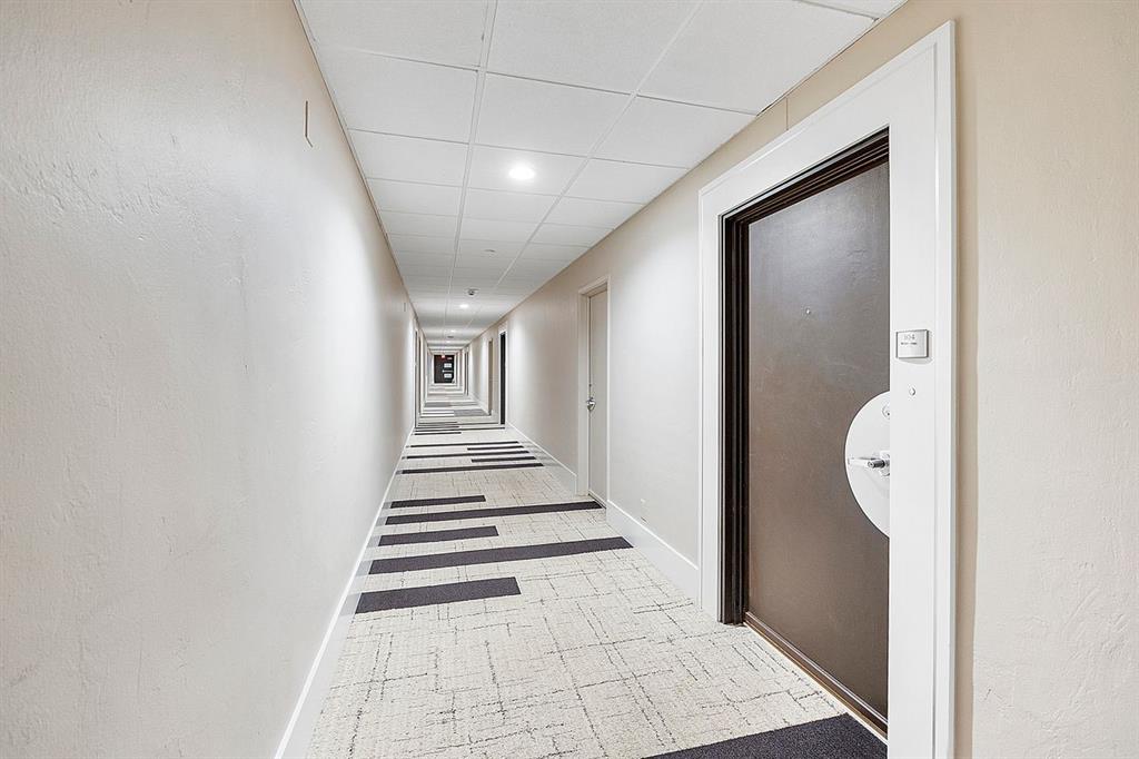 3300 Northeast 36th Street, Unit 303 Fort Lauderdale, FL 33308 - Photo 3 of 53 a view of a hallway with wooden floor and entryway