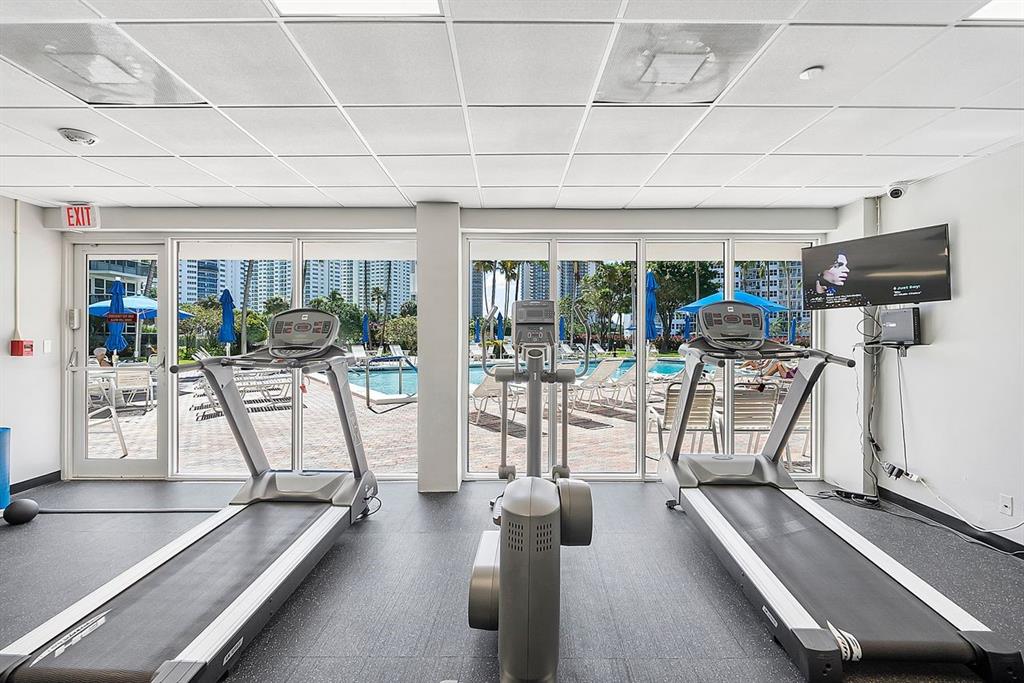 3300 Northeast 36th Street, Unit 303 Fort Lauderdale, FL 33308 - Photo 32 of 53 a view of a room with gym equipment