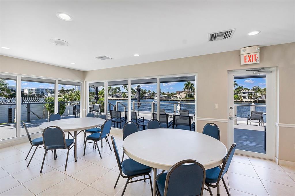 3300 Northeast 36th Street, Unit 303 Fort Lauderdale, FL 33308 - Photo 39 of 53 a view of a dining room with furniture window and outside view