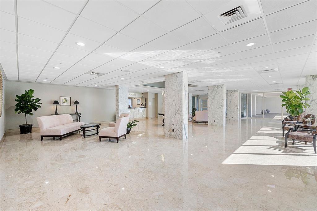 3300 Northeast 36th Street, Unit 303 Fort Lauderdale, FL 33308 - Photo 43 of 53 a living room with furniture and a potted plant