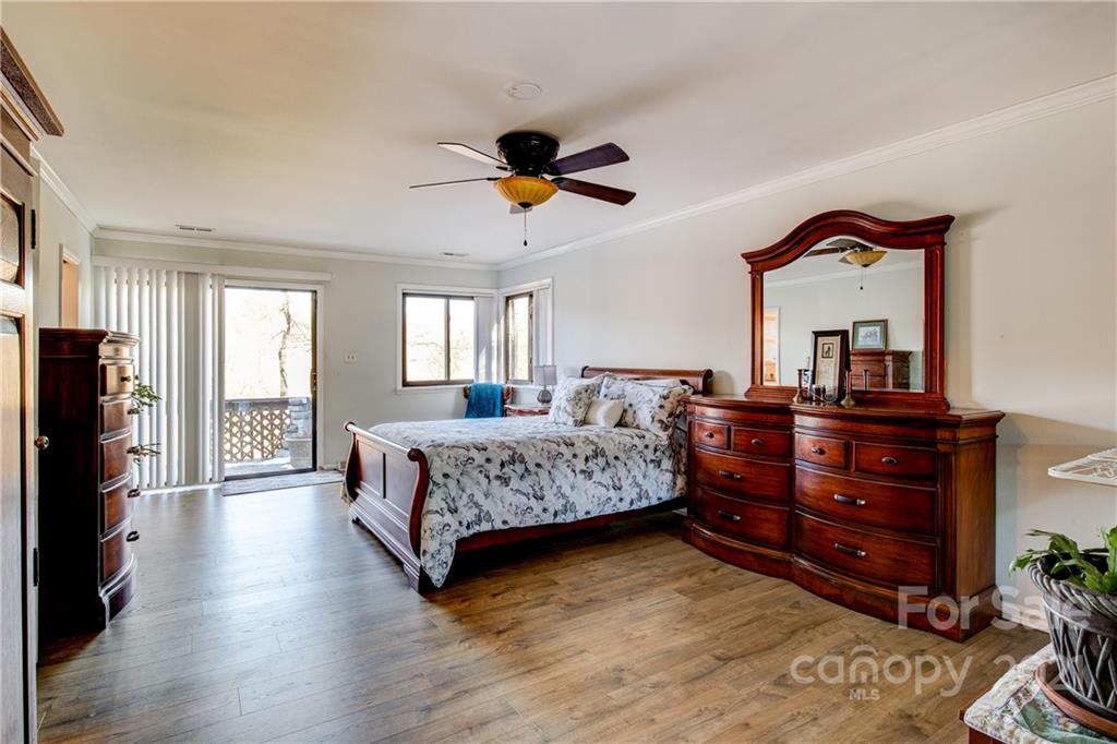 10043 Tepa Place Tega Cay, SC 29708 - Photo 11 of 32 a living room with a bed furniture and a flat tv screen