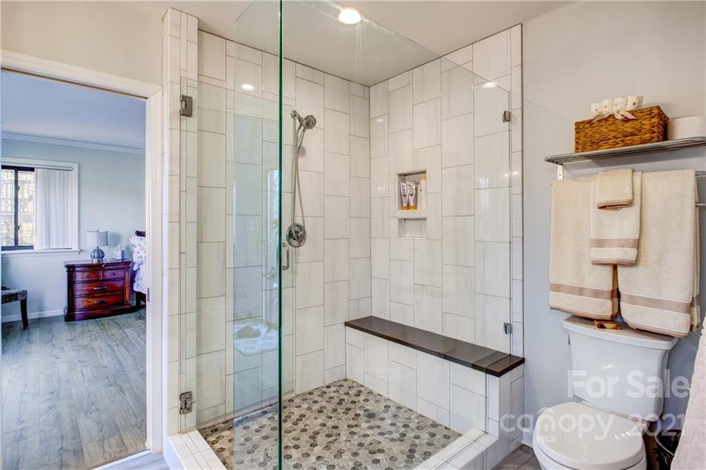 10043 Tepa Place Tega Cay, SC 29708 - Photo 14 of 32 a bathroom with a sink and a shower