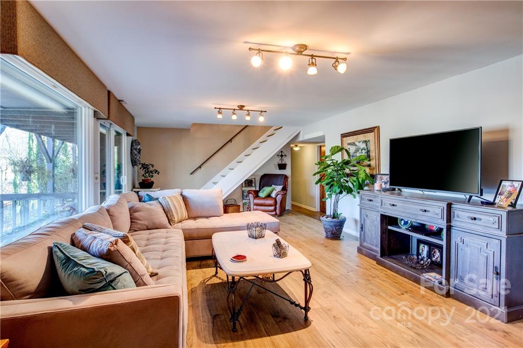 10043 Tepa Place Tega Cay, SC 29708 - Photo 16 of 32 a living room with furniture and a flat screen tv