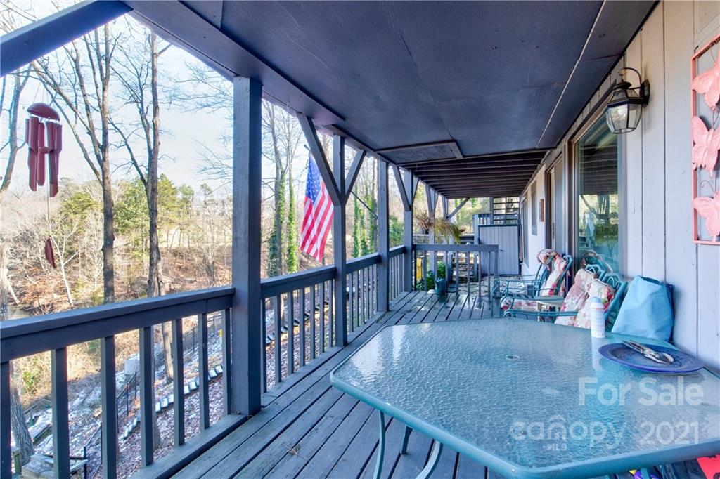10043 Tepa Place Tega Cay, SC 29708 - Photo 19 of 32 a view of a porch with wooden floor