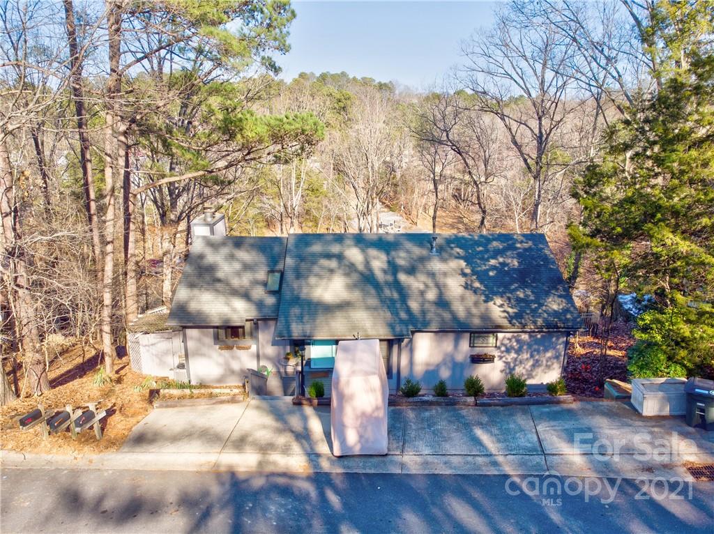 10043 Tepa Place Tega Cay, SC 29708 - Photo 29 of 32 a view of a street with a tree in the background