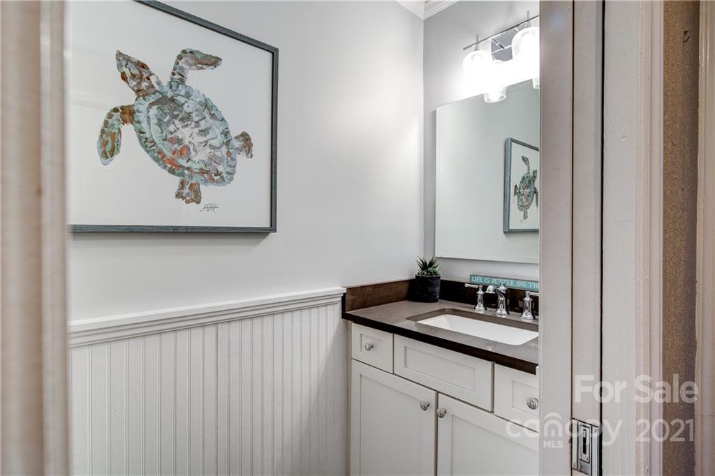 10043 Tepa Place Tega Cay, SC 29708 - Photo 10 of 32 a bathroom with a sink and a mirror
